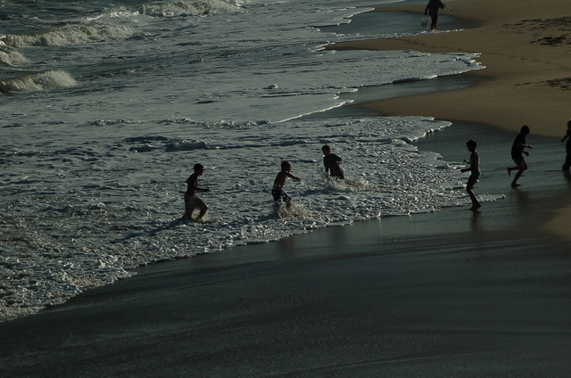kids playing at shoreline